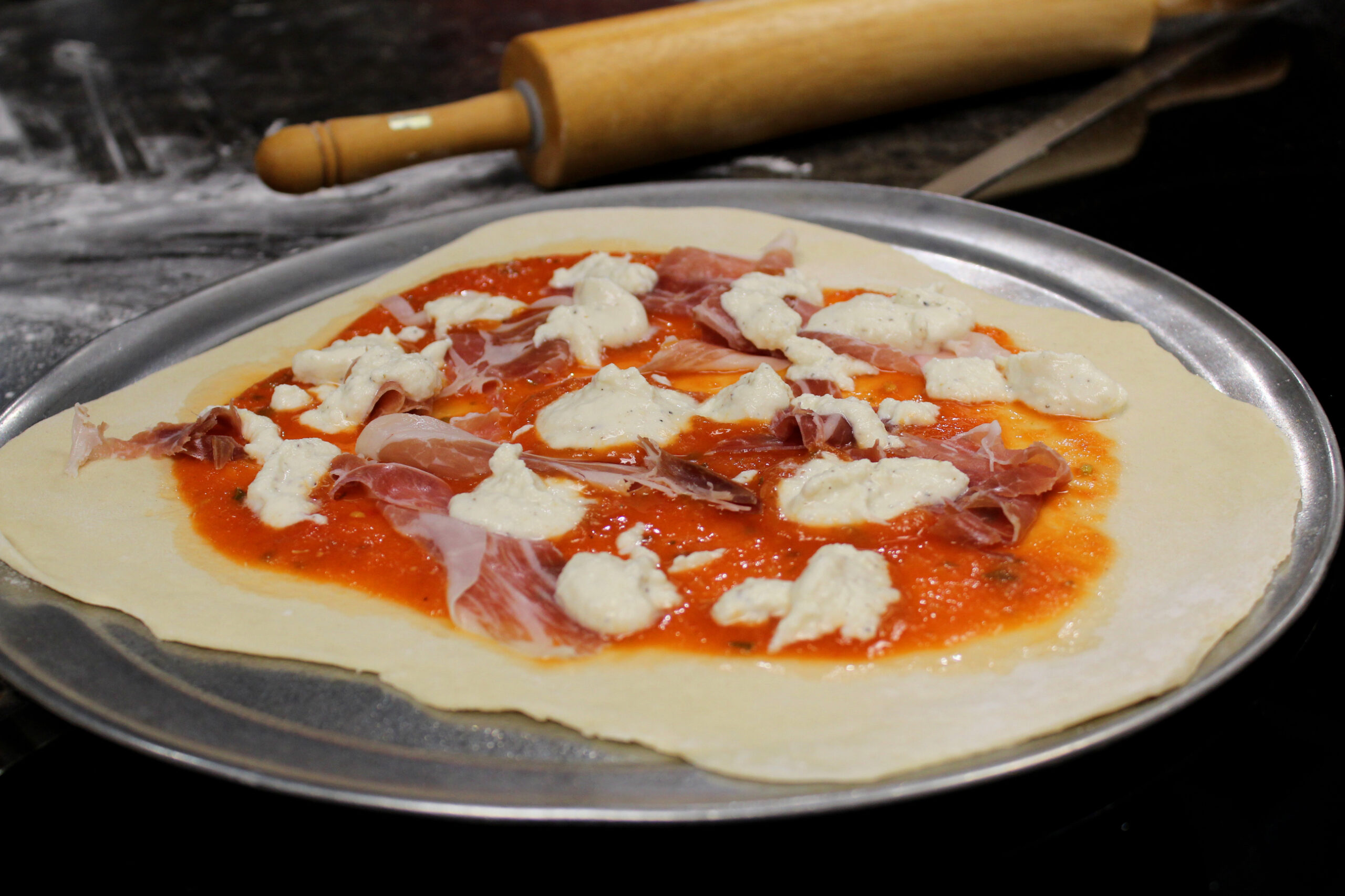 Create your own pizza with prosciutto ham and ricotta cheese