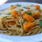 Colorful butternut squash pasta is ideal as a meatless main with fresh herbs, crispy Panko crumbs, shaved Parmesan cheese and baked squash